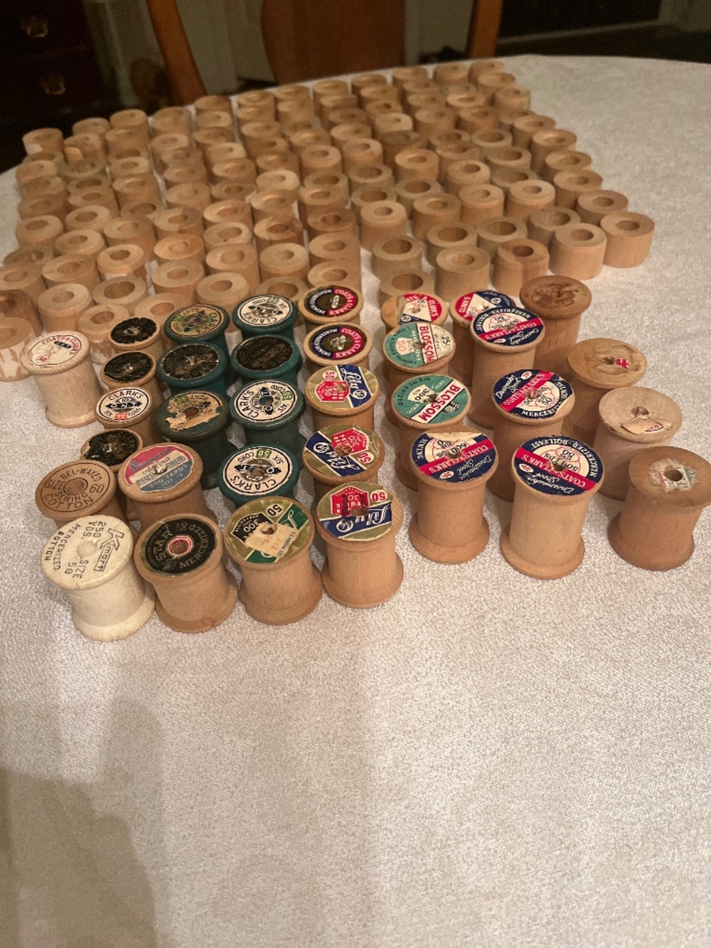 Vintage wooden sewing spools, over 100